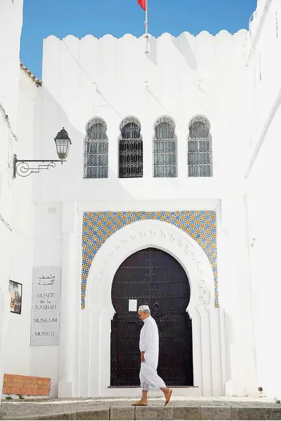 White Moroccan museum entrance with traditional tilework