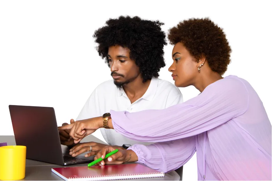 Two professionals reviewing work together on a laptop